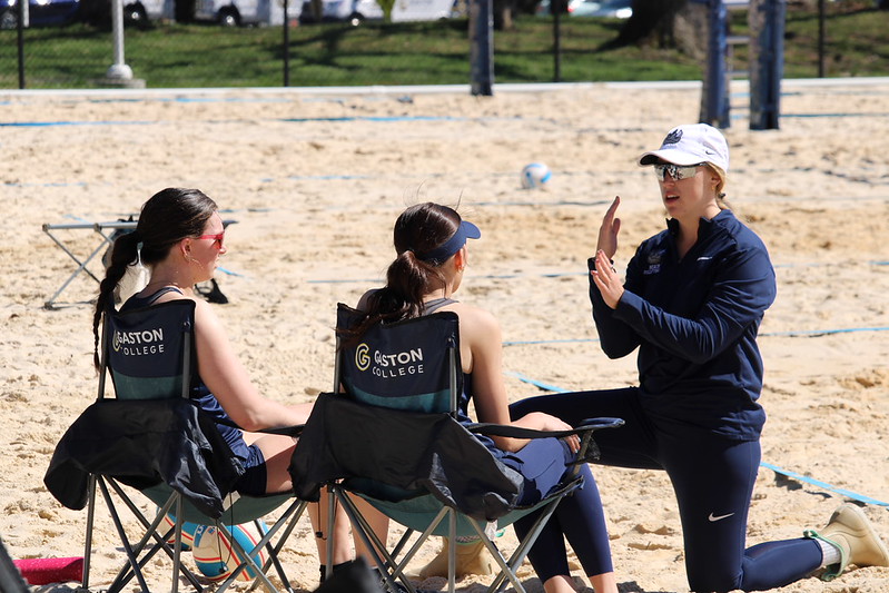 Gaston College's beach volleyball program returned in the 2025-26 school year with coach Annelle Grealis (right) guiding the Rhinos.