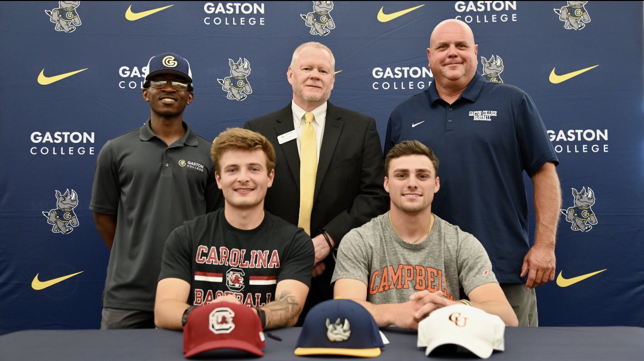 Gaston College baseball players Zach Zedalis (South Carolina) and Chandler Riley (Campbell) became the school's first four-year college signees on Nov. 10, 2021. They are pictured with (left to right top row) assistant coach K.J. McAllister, school president Dr. John Hauser and head coach Shohn Doty.