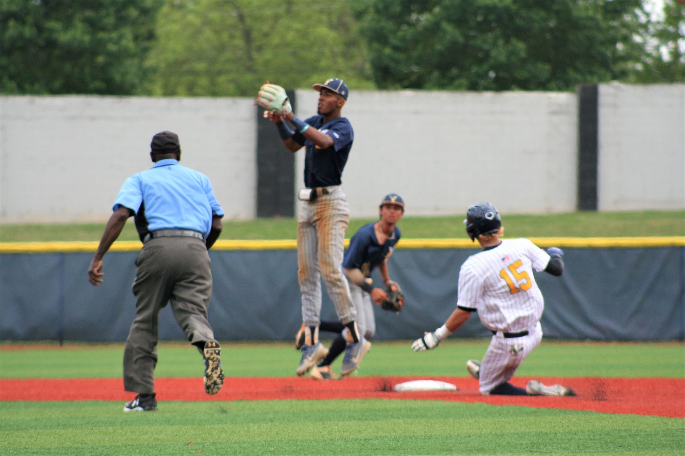 Gaston College's Wade Kelly steals second base during a 2022 game.