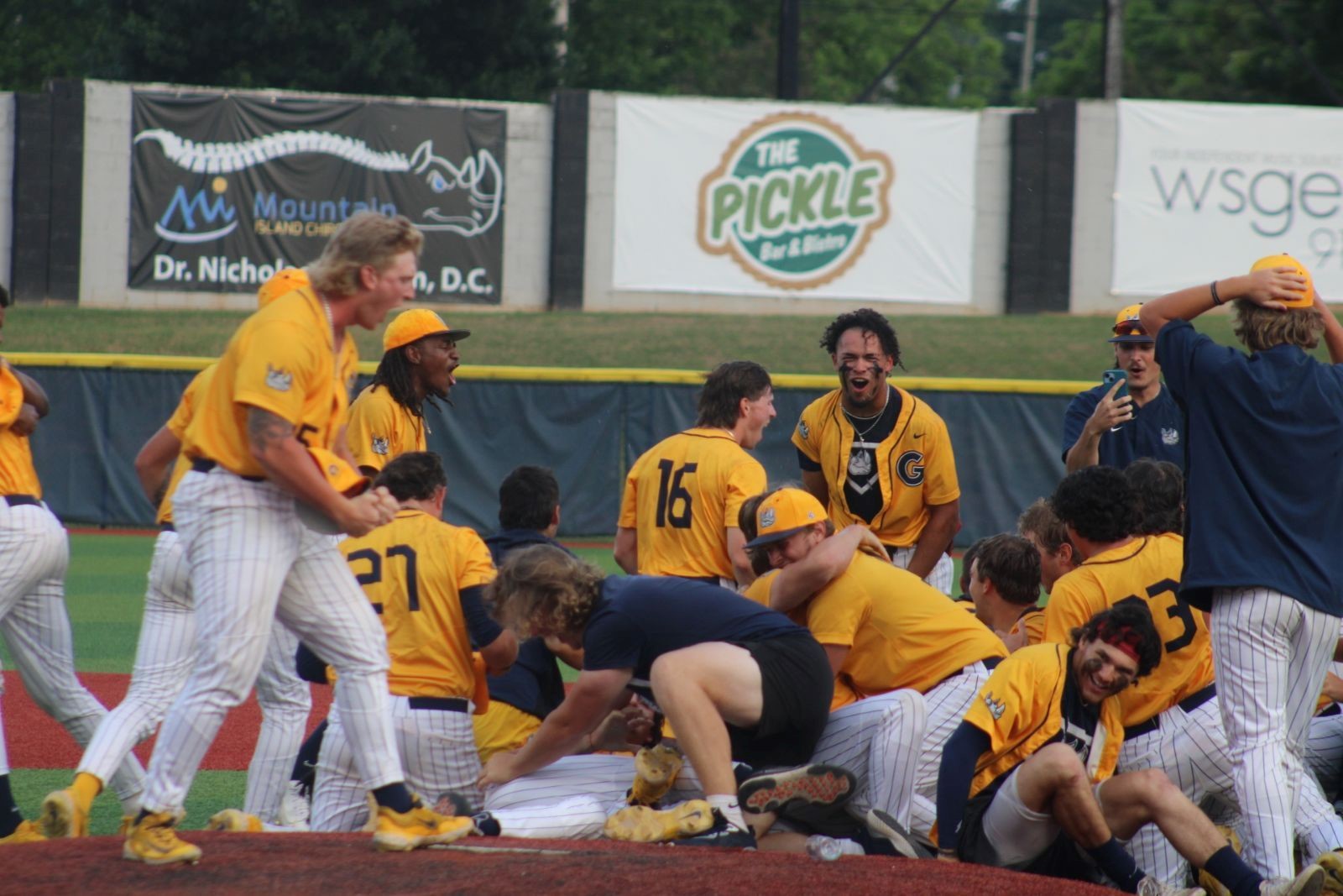 Gaston College's baseball team celebrates after winning the 2023 NJCAA Eastern District championship at Gastonia's Sims Legion Park.