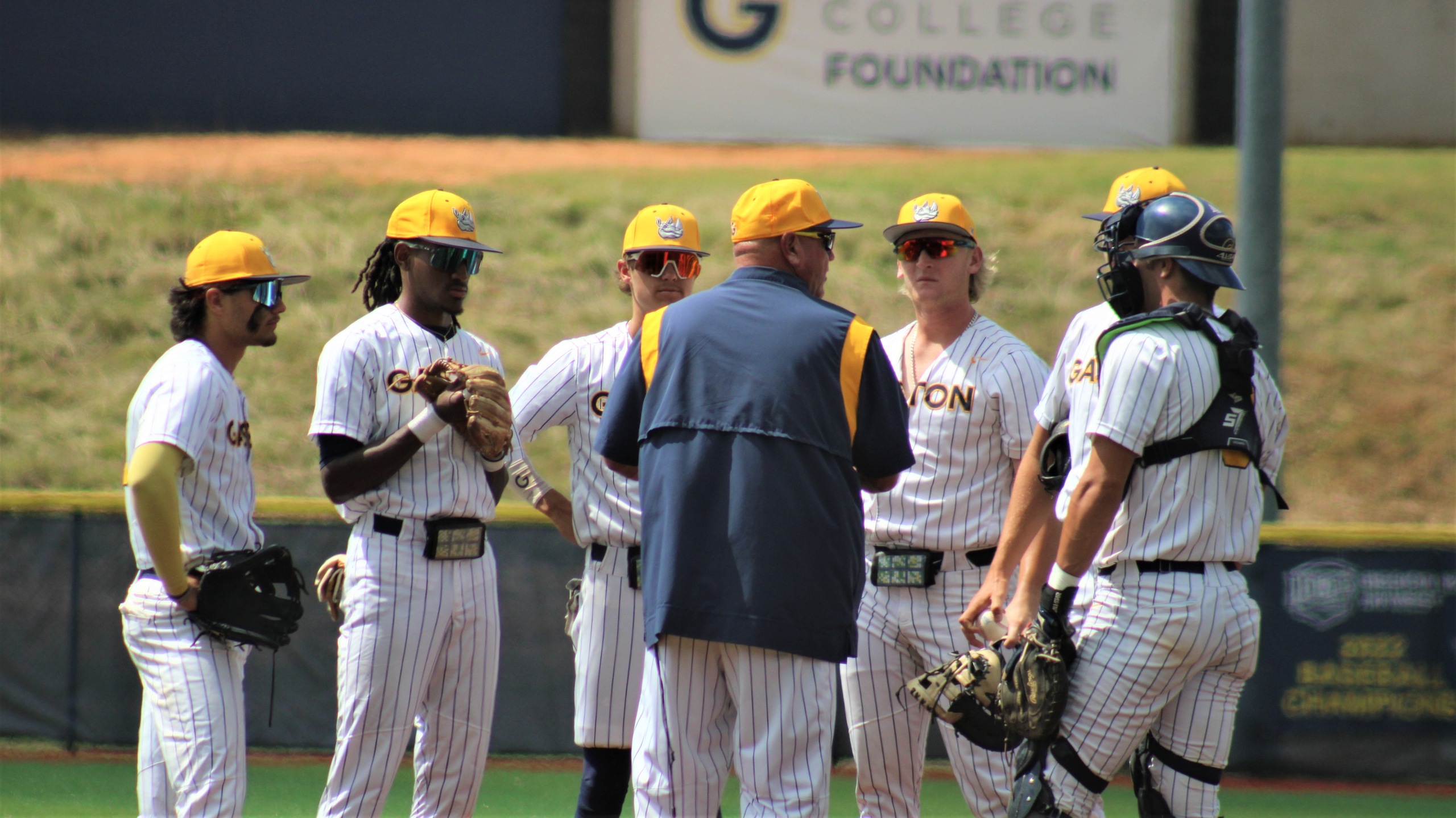 Gaston College's Shohn Doty talks to his players during a mound visit in the NJCAA East District tournament played at Gastonia's Sims Legion Park.