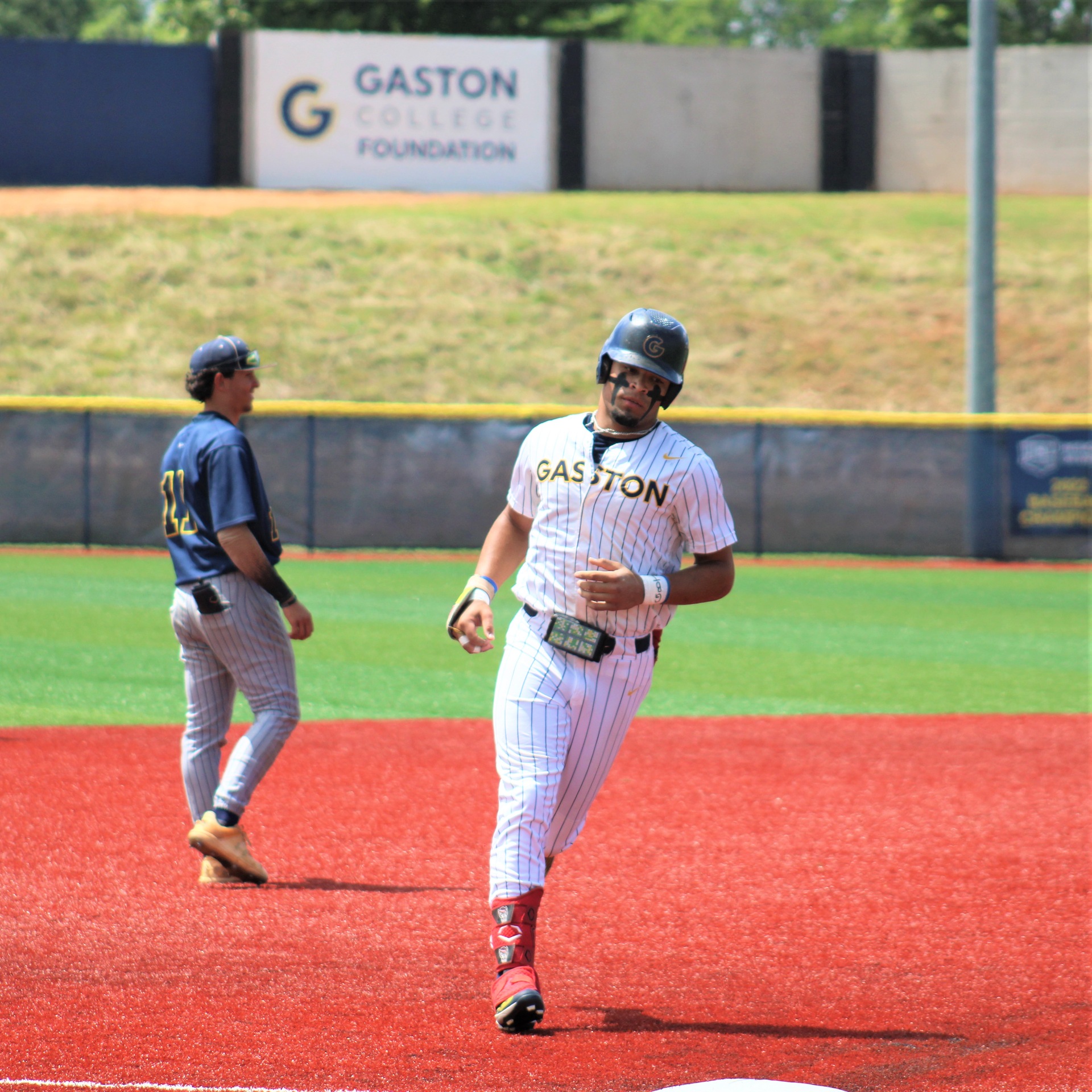 Gaston College's Trey Truitt rounds 3rd base after hitting a home run during the NJCAA East District tournament at Gastonia's Sims Legion Park.
