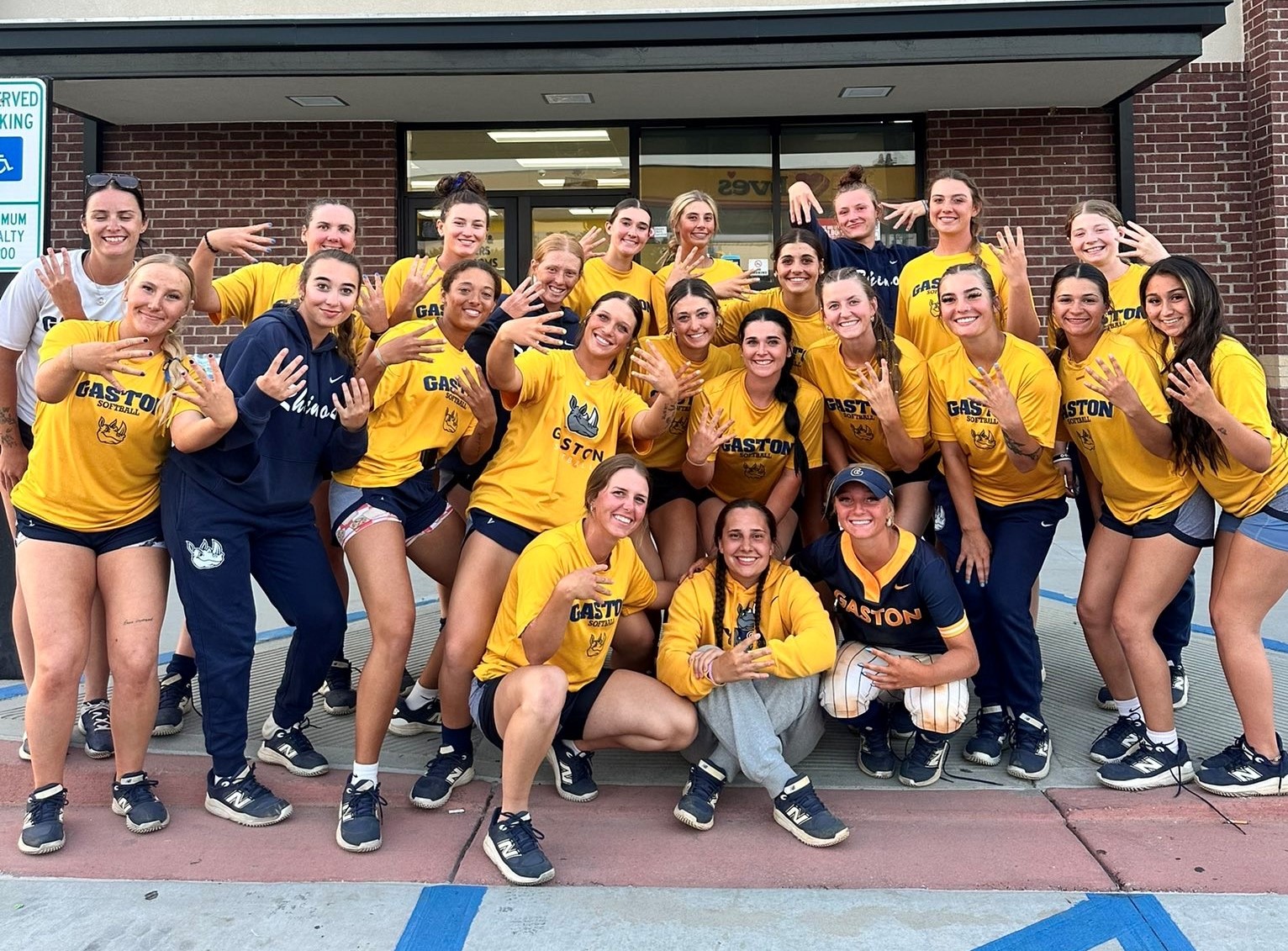 Gaston College's 2026 softball team celebrates the school's fourth straight Region 10 regular season title after Wednesday's doubleheader sweep at Florence Darlington Tech.