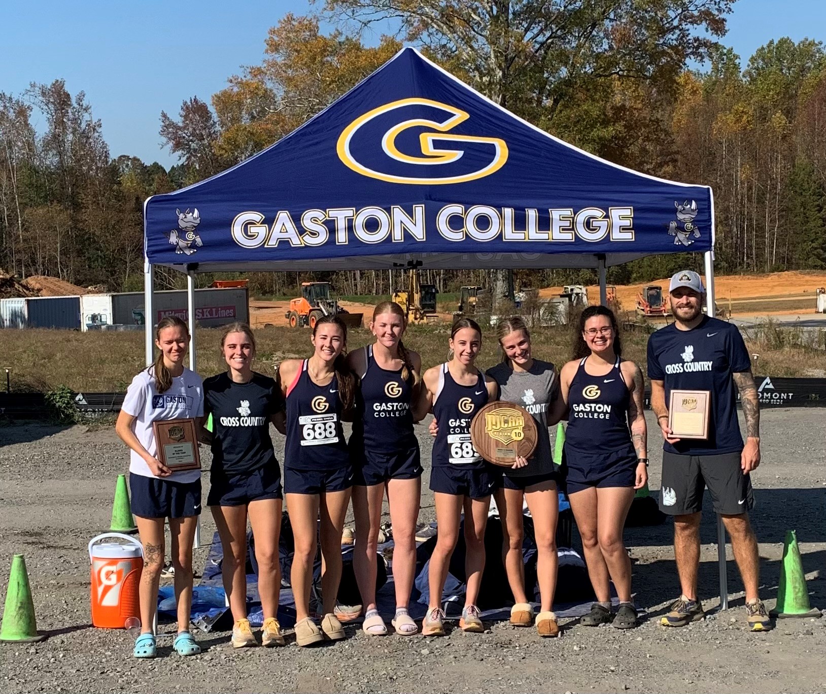 Gaston College's cross country poses for a team photo after the Rhinos won their first-ever Region 10 title in Shelby.