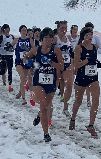 Lexi Birtwistle (179) chugs through the elements during Saturday's NJCAA cross country national championship meet.